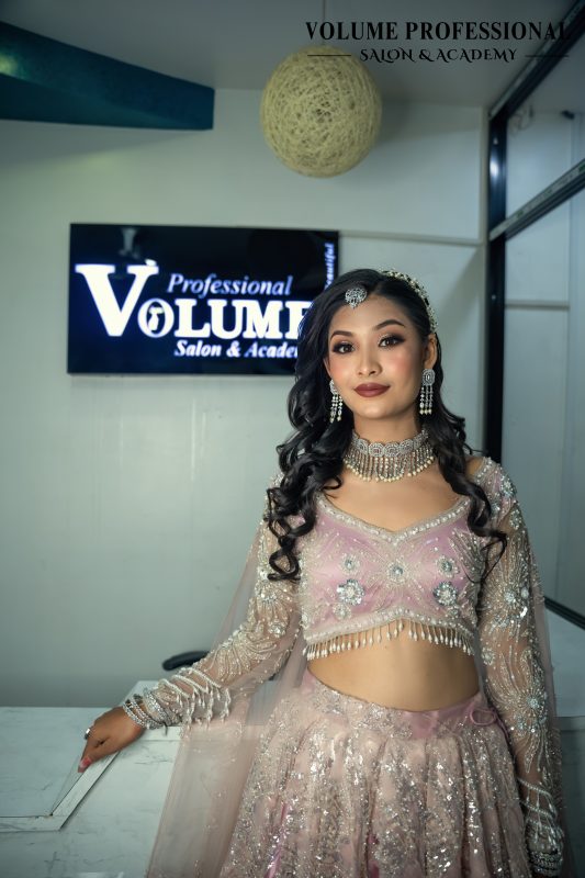 Professional bridal makeup look with soft glam styling by Volume Professional Salon and Academy